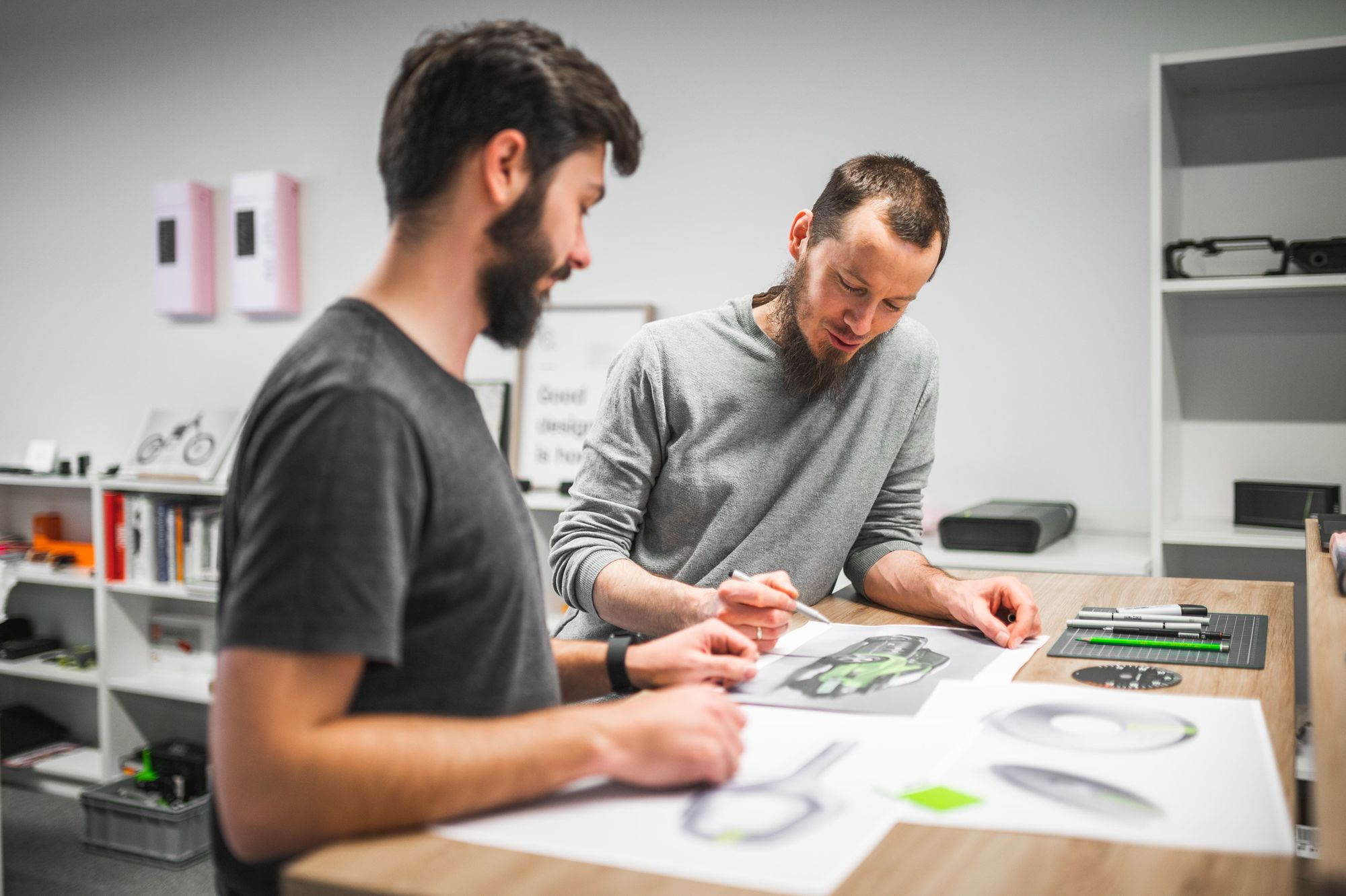 two men working with schemes